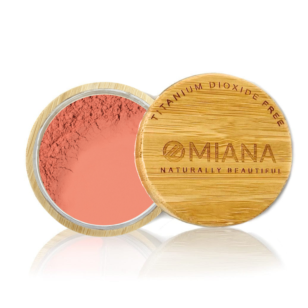 Omiana Loose Powder Mineral Blush Makeup in a bamboo container on a white background