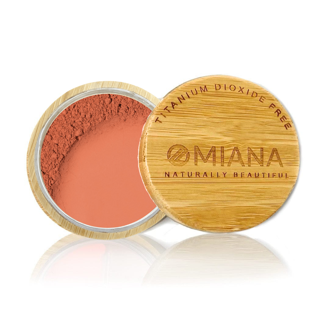 Omiana Loose Powder Mineral Blush Makeup in a bamboo container on a white background