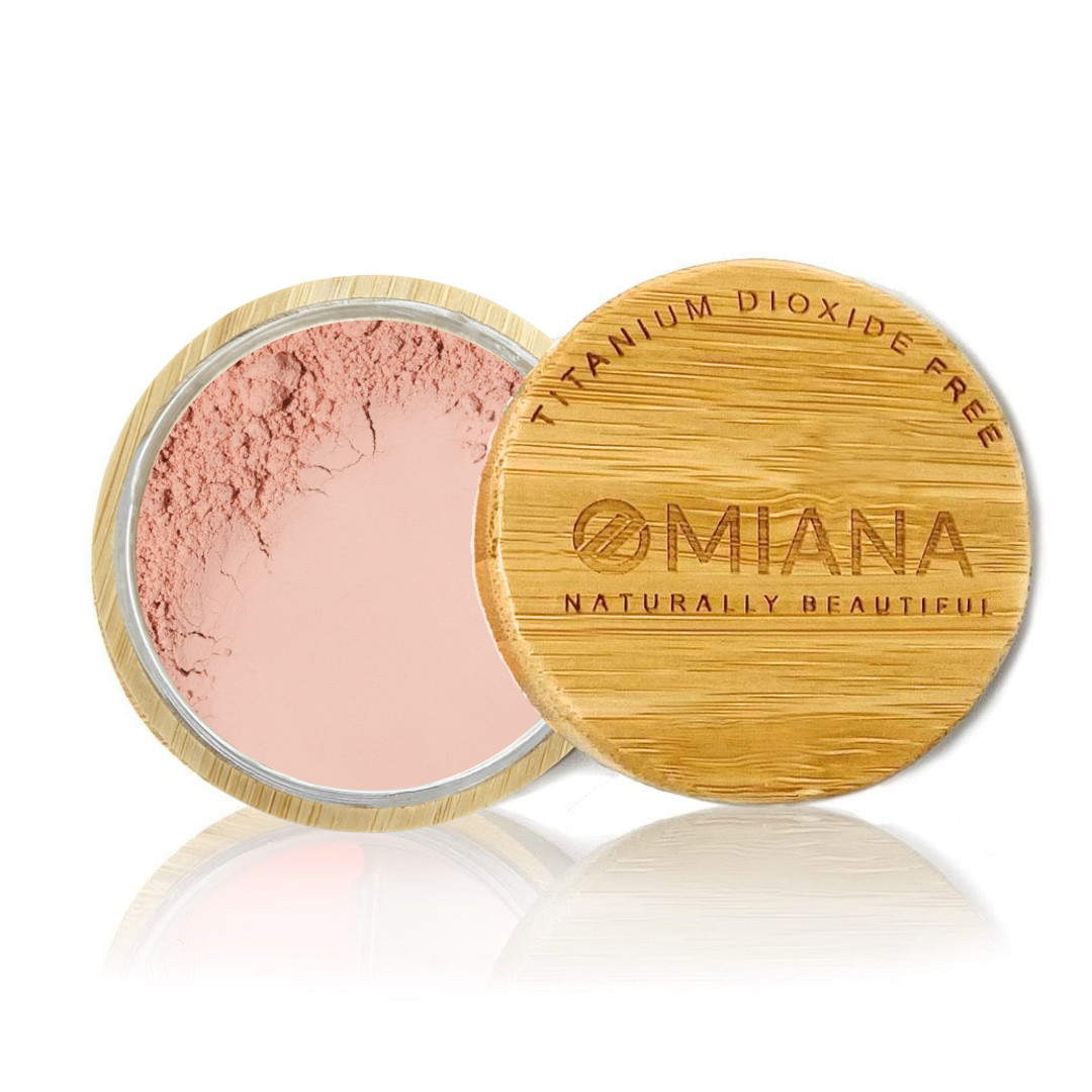 Omiana Loose Powder Mineral Blush Makeup in a bamboo container on a white background