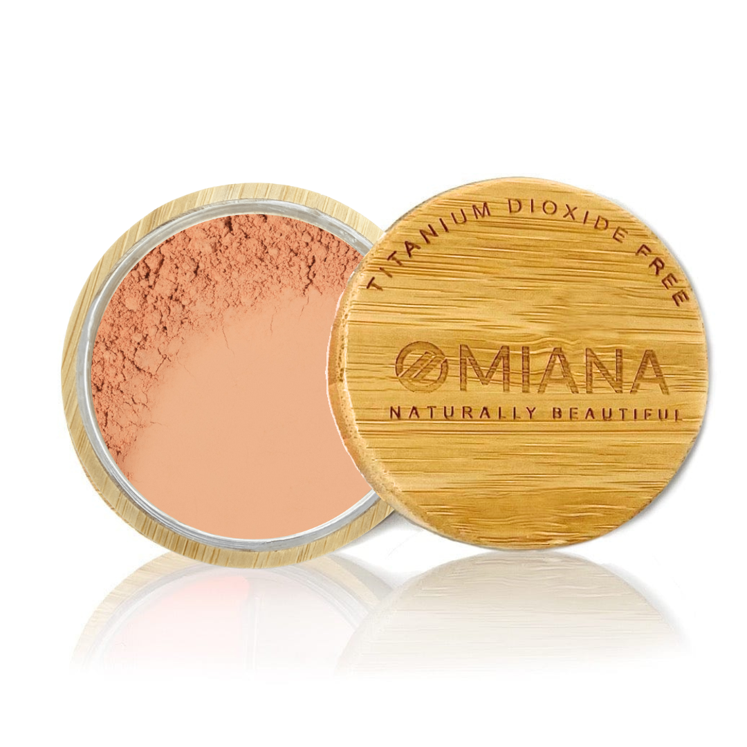 Omiana Loose Powder Mineral Blush Makeup in a bamboo container on a white background